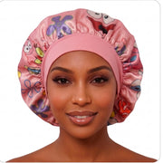 Cartoon Besties reversible satin bonnet pink side with wide fabric band