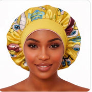 Cartoon Besties reversible satin bonnet yellow side with wide fabric band