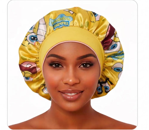 Cartoon Besties reversible satin bonnet yellow side with wide fabric band